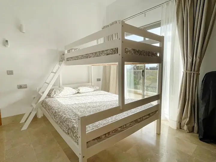 Second bedroom with a queen bed and bunk
